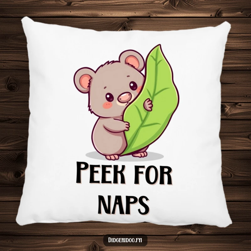 Funny wombat pillow featuring a curious character peeking from behind a bouncy gum leaf, bringing cute Aussie charm and humor.
