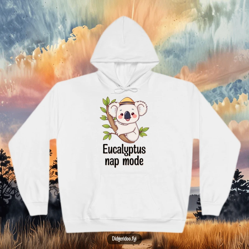 Funny koala in a hat, hugging a eucalyptus branch on a cozy hoodie, radiating warmth and offering a funny, huggable design.