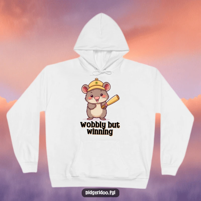 Funny Hoodie featuring a wobbly wombat wearing a small cricket cap, enthusiastically swinging a cricket bat. Comfortable and humorous sports apparel.