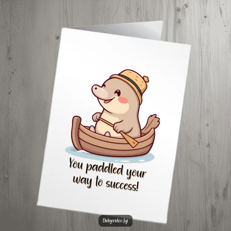 Funny Free Printable Congratulations Card: A giggling platypus wearing a cork hat paddles a small boat.